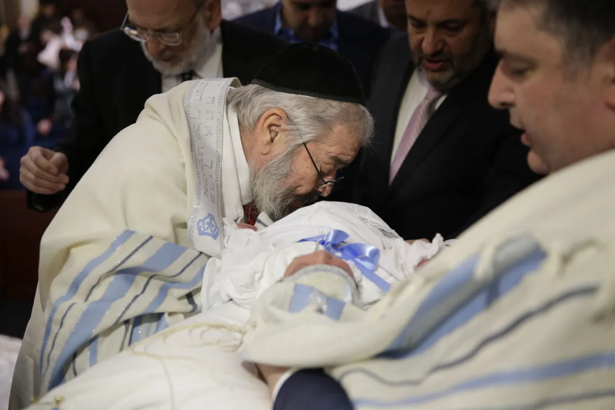 Jewish sexual predator puts his mouth on the bloody wound of a male baby's penis to suck the blood out.