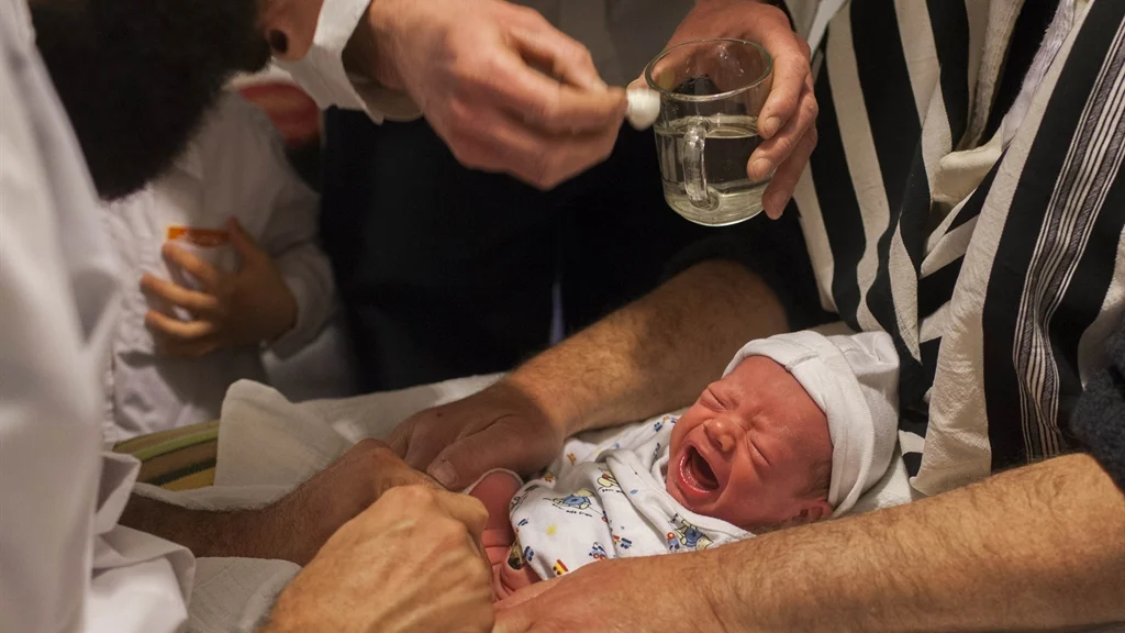 Baby boy cries profusely as predators rape and genitally mutilate him.